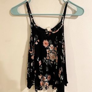 Floral tank top with shoulder cut outs. Size medium.